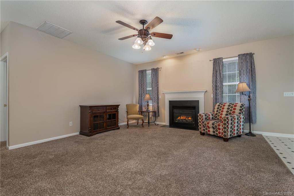 52 Wildbriar Road Fletcher, NC 28732 - Photo 11 of 29 a living room with furniture and a fireplace