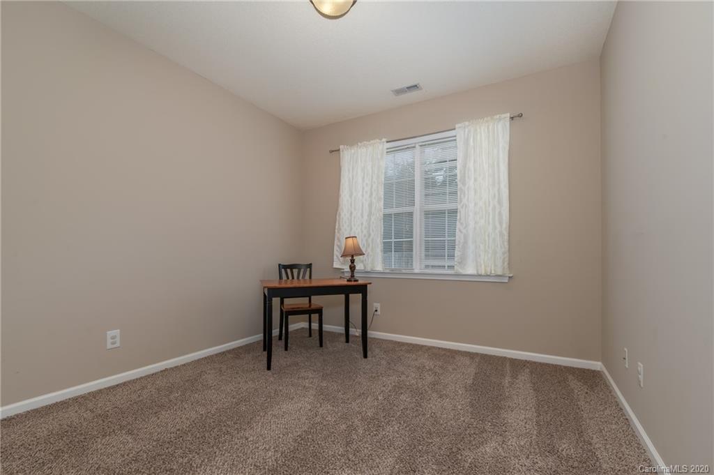 52 Wildbriar Road Fletcher, NC 28732 - Photo 12 of 29 a view of a workspace with furniture and a window