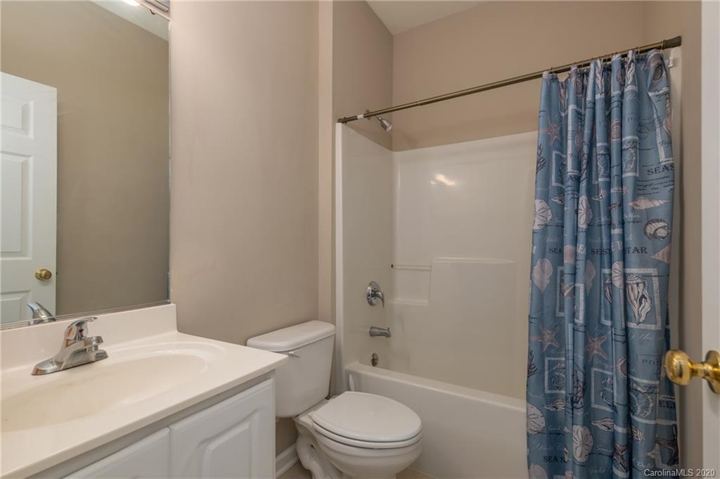 52 Wildbriar Road Fletcher, NC 28732 - Photo 14 of 29 a bathroom with a sink a toilet and shower