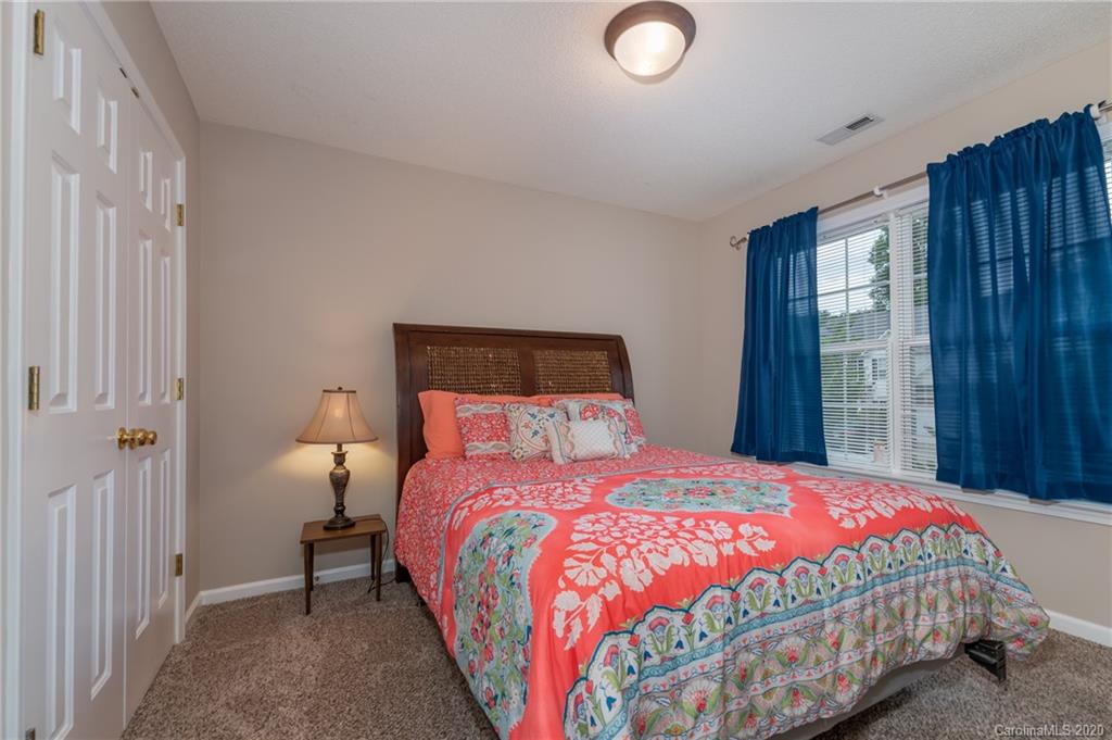 52 Wildbriar Road Fletcher, NC 28732 - Photo 16 of 29 a bedroom with a bed and a window