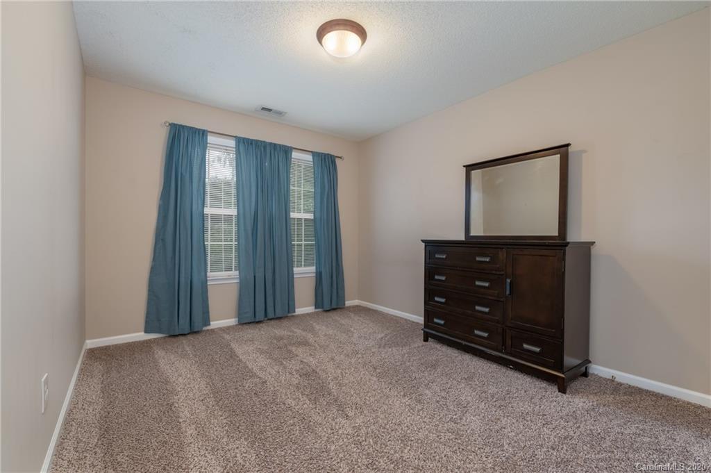 52 Wildbriar Road Fletcher, NC 28732 - Photo 17 of 29 a room with a dresser and a mirror