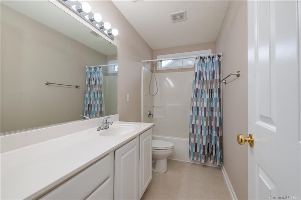 52 Wildbriar Road Fletcher, NC 28732 - Photo 19 of 29 a bathroom with a sink a toilet and shower