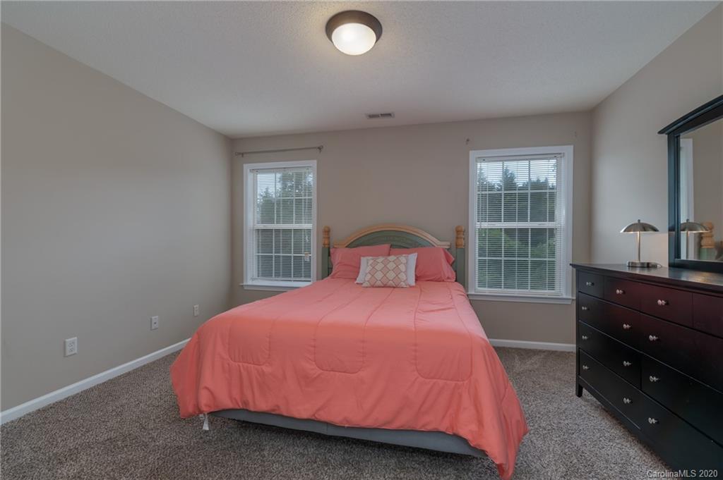 52 Wildbriar Road Fletcher, NC 28732 - Photo 20 of 29 a bedroom with a bed and window
