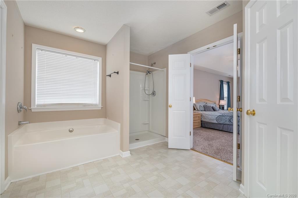 52 Wildbriar Road Fletcher, NC 28732 - Photo 24 of 29 a bathroom with a tub shower and a sink
