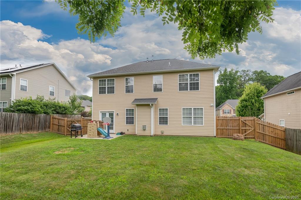 52 Wildbriar Road Fletcher, NC 28732 - Photo 29 of 29 a view of a house with backyard and a garden