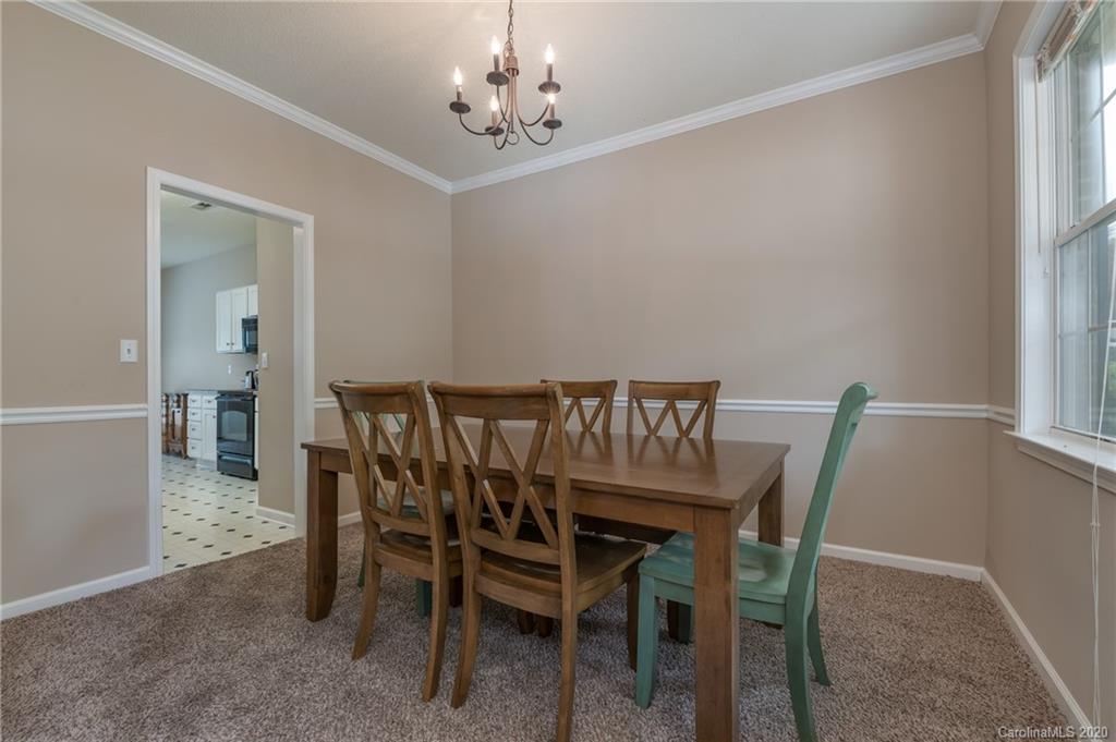 52 Wildbriar Road Fletcher, NC 28732 - Photo 6 of 29 a view of a dining room with furniture and chandelier