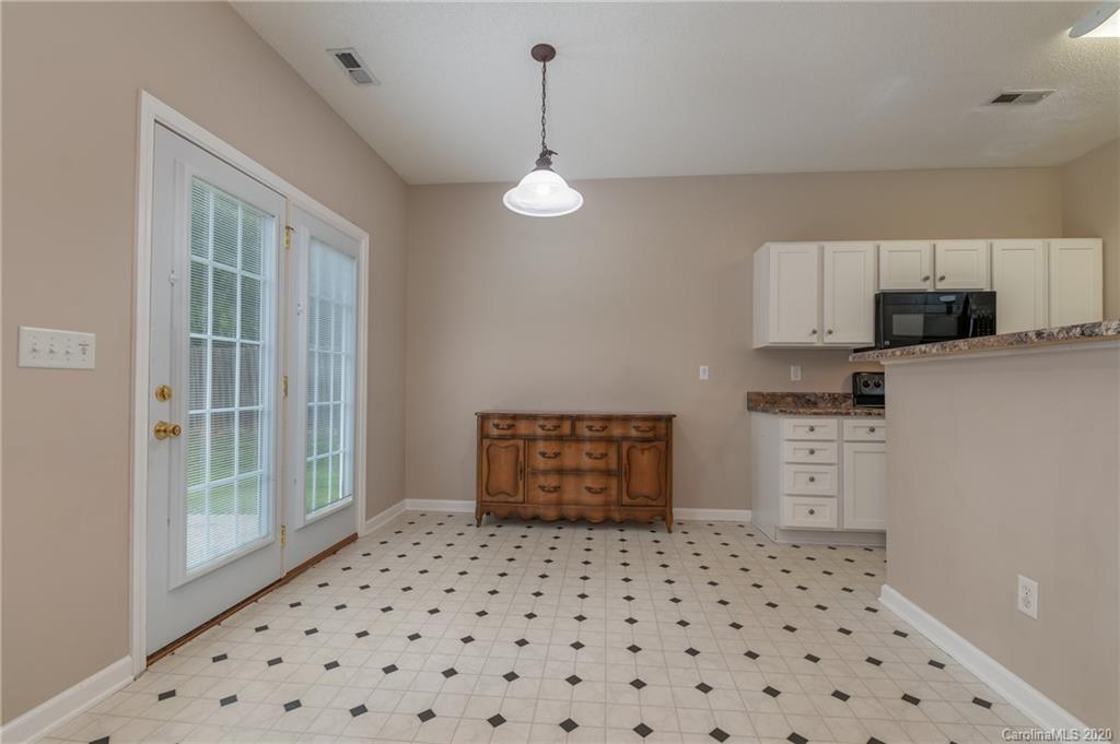 52 Wildbriar Road Fletcher, NC 28732 - Photo 9 of 29 a room with a cabinets and a window