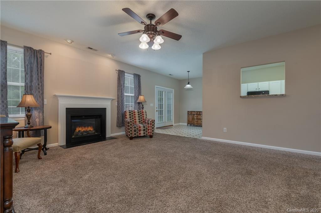52 Wildbriar Road Fletcher, NC 28732 - Photo 10 of 29 a view of a livingroom with a fireplace and a chandelier fan