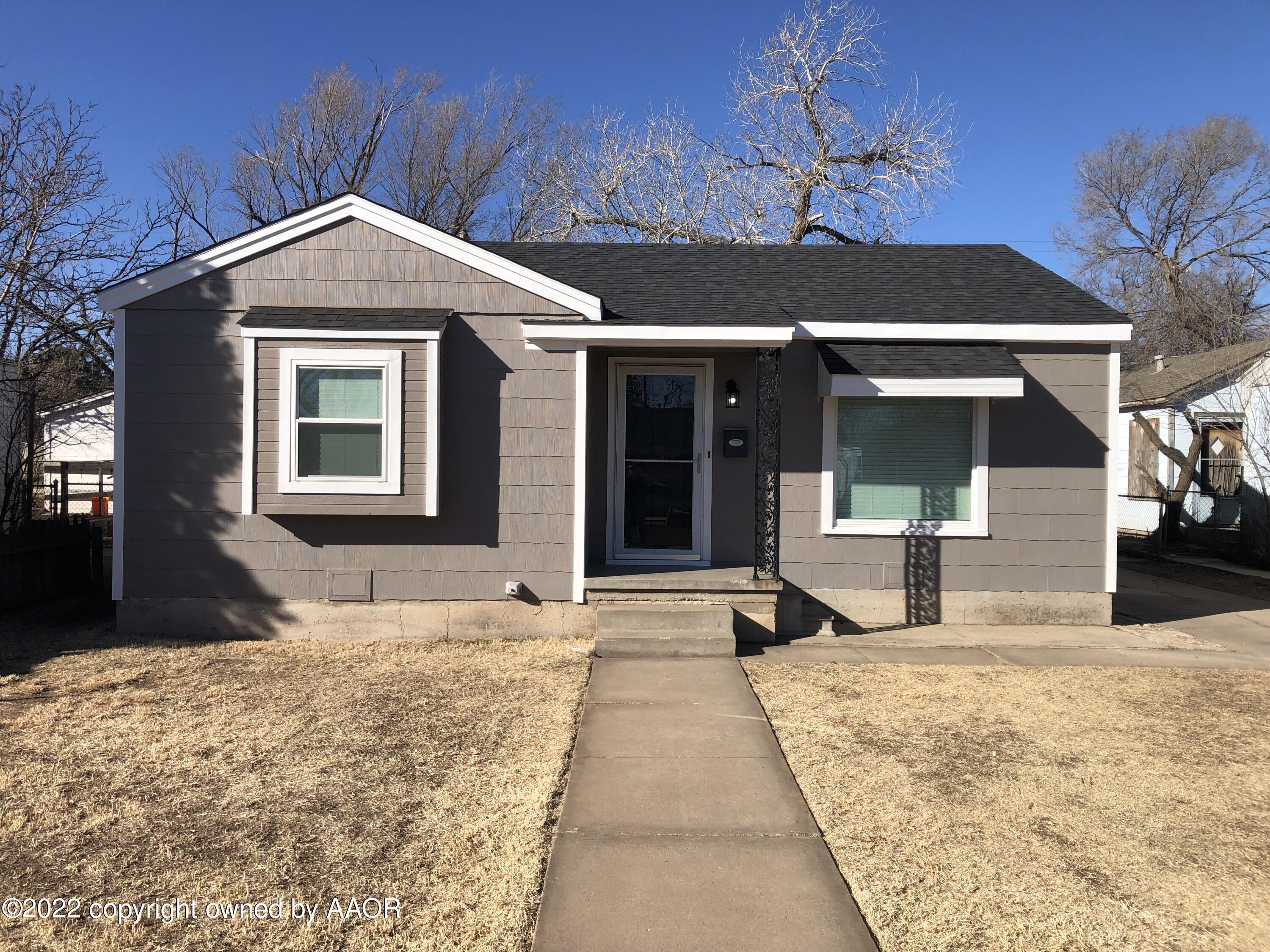 4122 Gables Street Amarillo, TX 79110 - Photo 1 of 2 a front view of a house with a yard