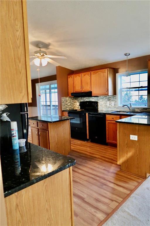128 Airport Road Mercer, PA 16137 - Photo 15 of 36 a kitchen with granite countertop a stove and cabinets