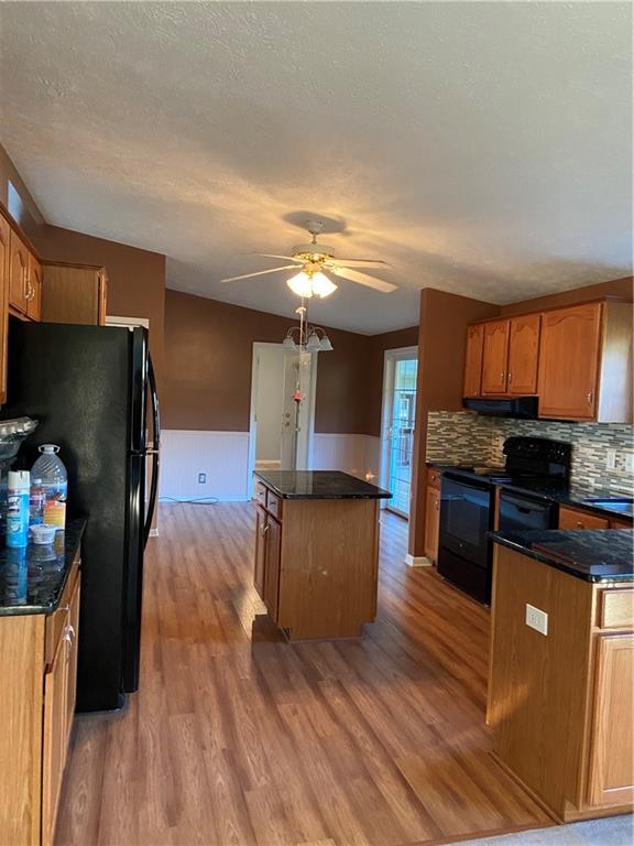 128 Airport Road Mercer, PA 16137 - Photo 16 of 36 a kitchen with granite countertop a refrigerator stove top oven and sink