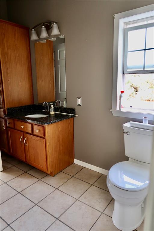 128 Airport Road Mercer, PA 16137 - Photo 18 of 36 a bathroom with a toilet a sink and a mirror