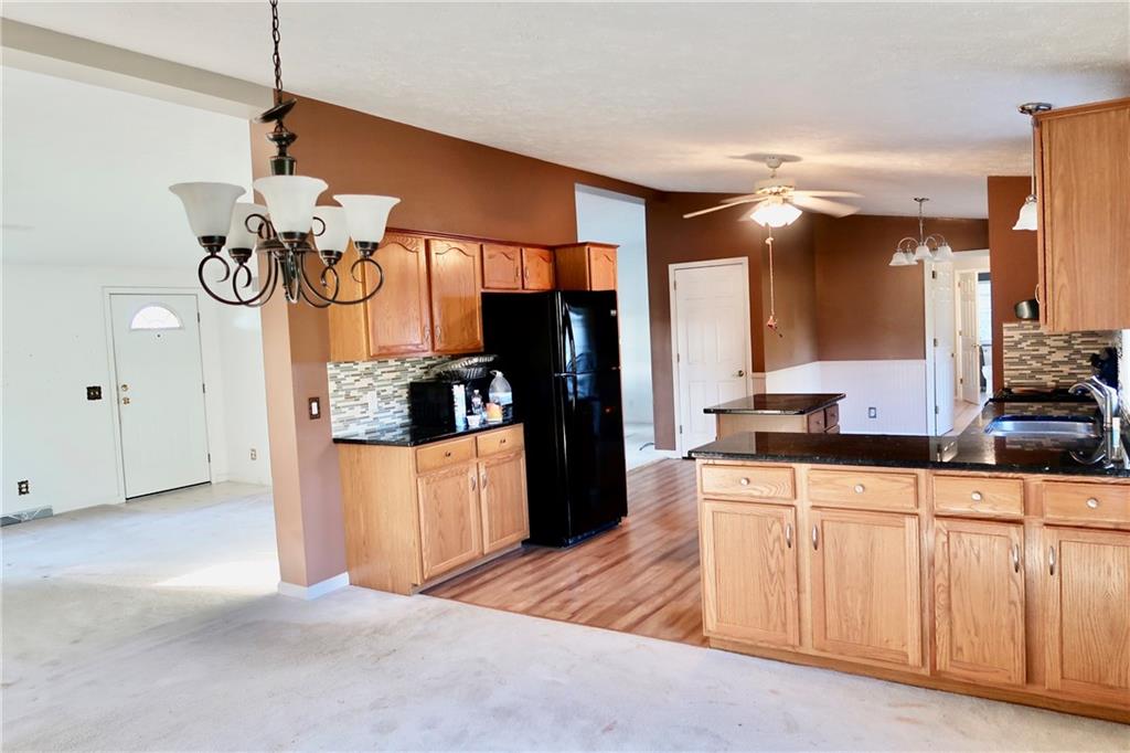 128 Airport Road Mercer, PA 16137 - Photo 20 of 36 a kitchen with sink cabinets and refrigerator