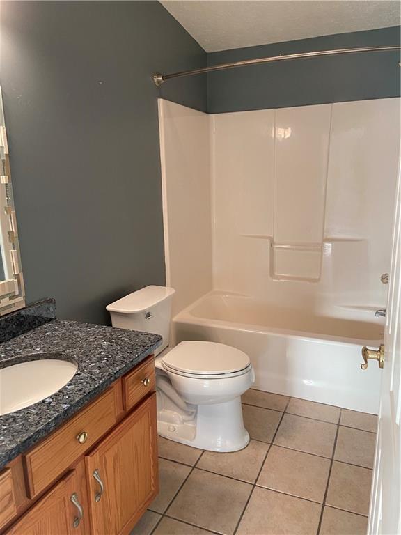 128 Airport Road Mercer, PA 16137 - Photo 24 of 36 a bathroom with a granite countertop toilet sink and mirror