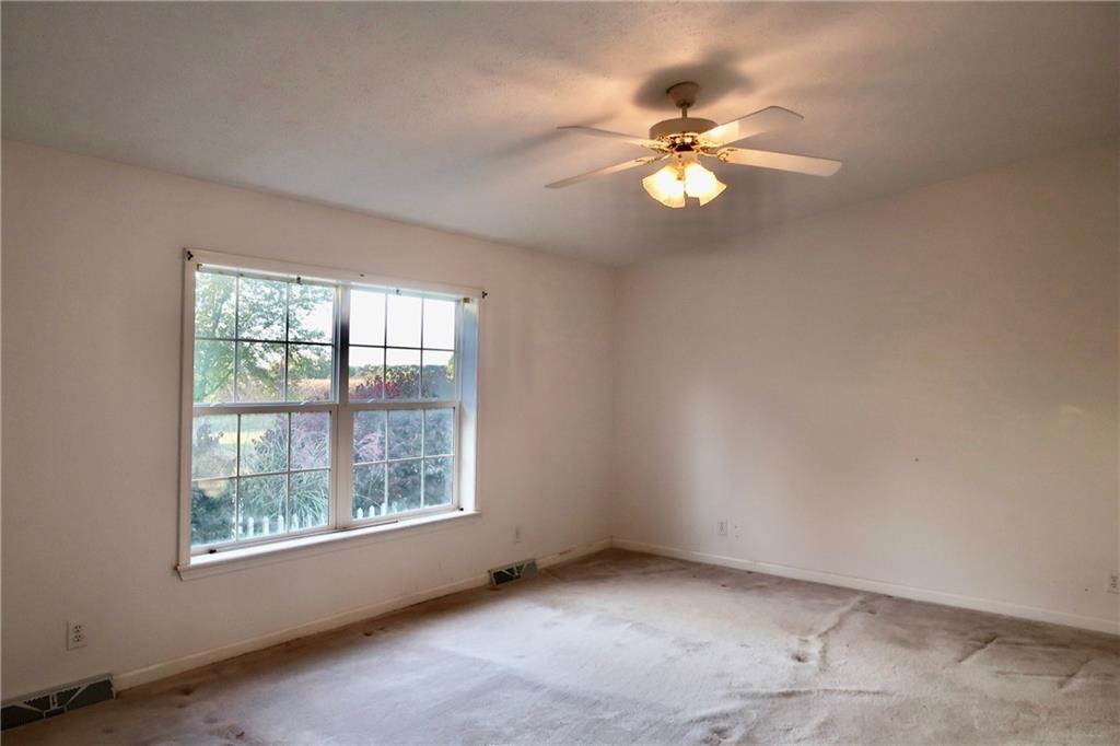 128 Airport Road Mercer, PA 16137 - Photo 29 of 36 an empty room with windows and fan