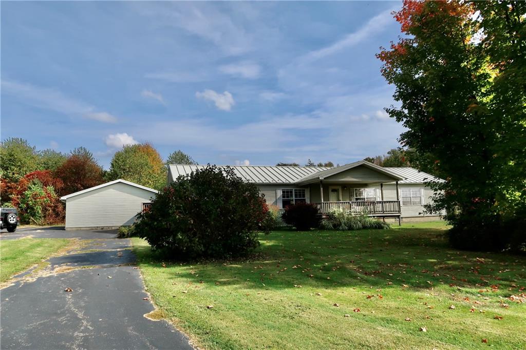 128 Airport Road Mercer, PA 16137 - Photo 35 of 36 a front view of a house with garden