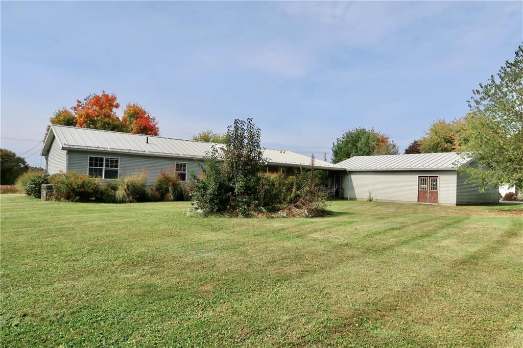 128 Airport Road Mercer, PA 16137 - Photo 5 of 36 a view of a house with a outdoor space and a yard