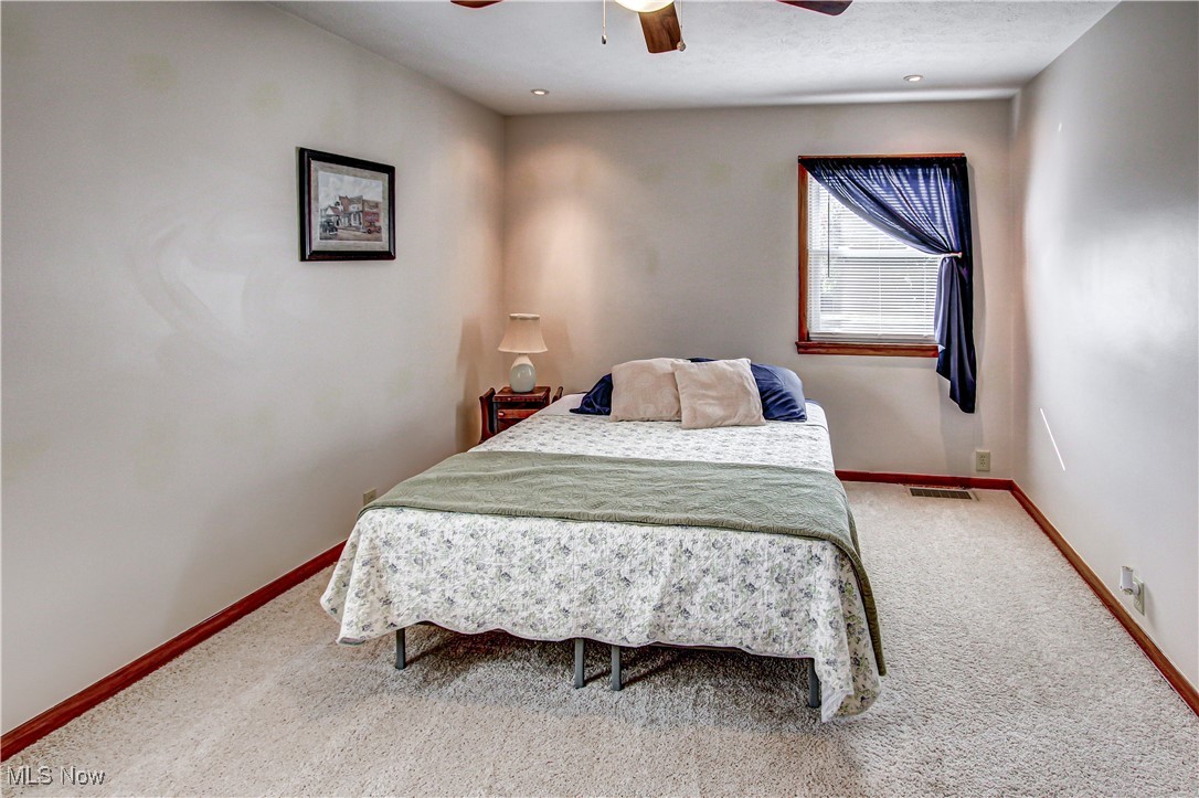 4234 Grafton Road Brunswick, OH 44212 - Photo 18 of 40 Carpeted bedroom with ceiling fan