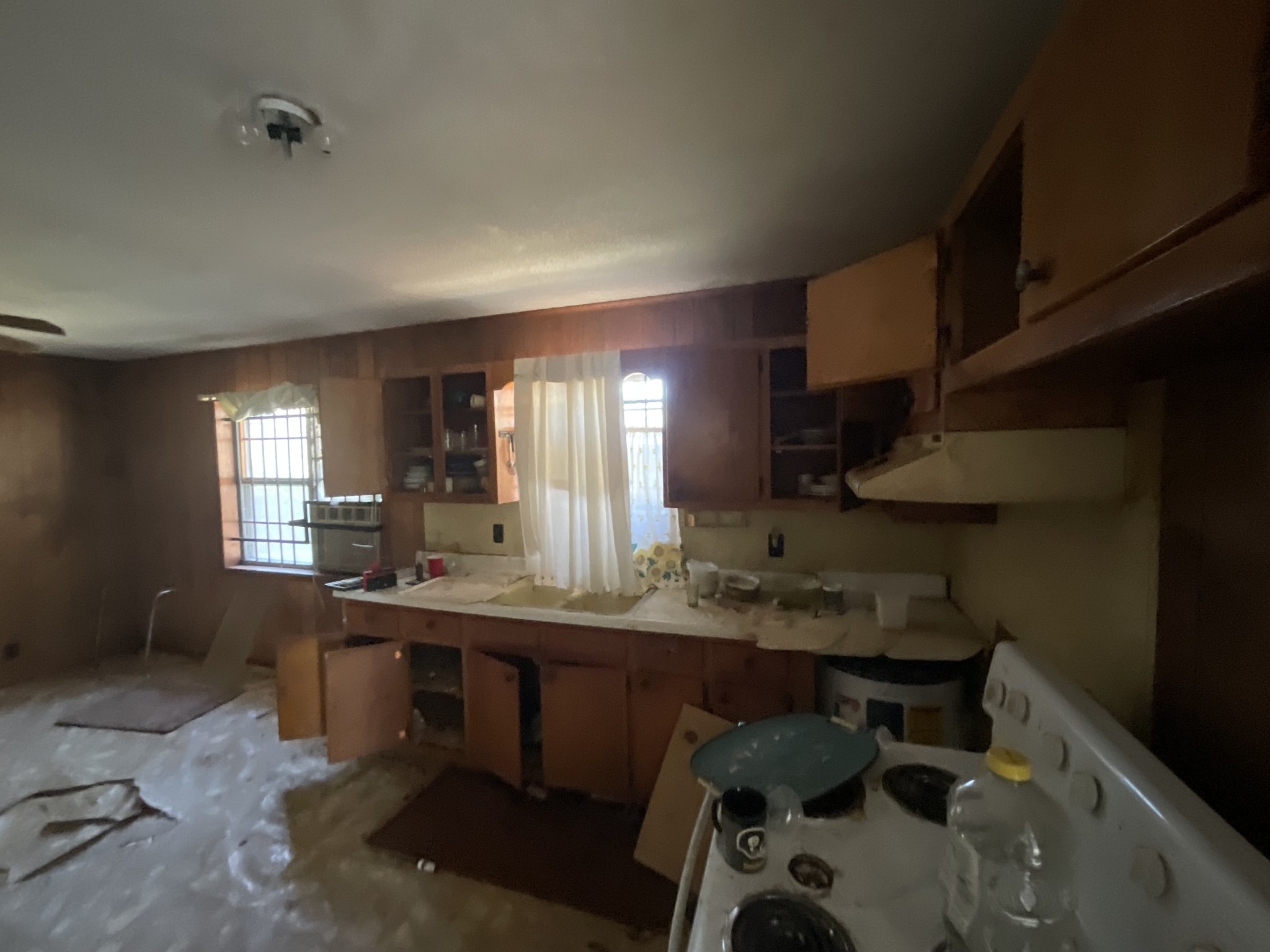 1035 Rube Scott Road Grand Junction, TN 38039 - Photo 22 of 22 a kitchen with a sink a stove and chairs
