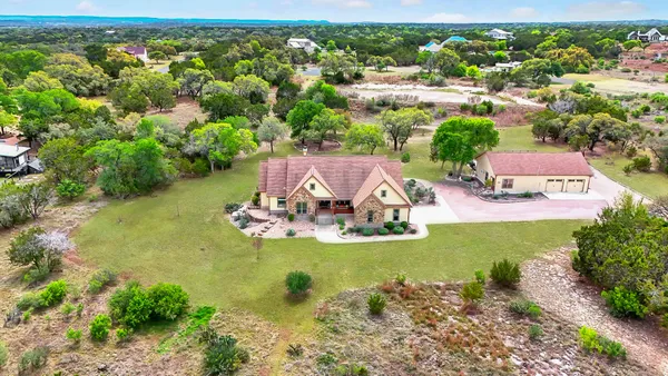 an aerial view of a house with a garden