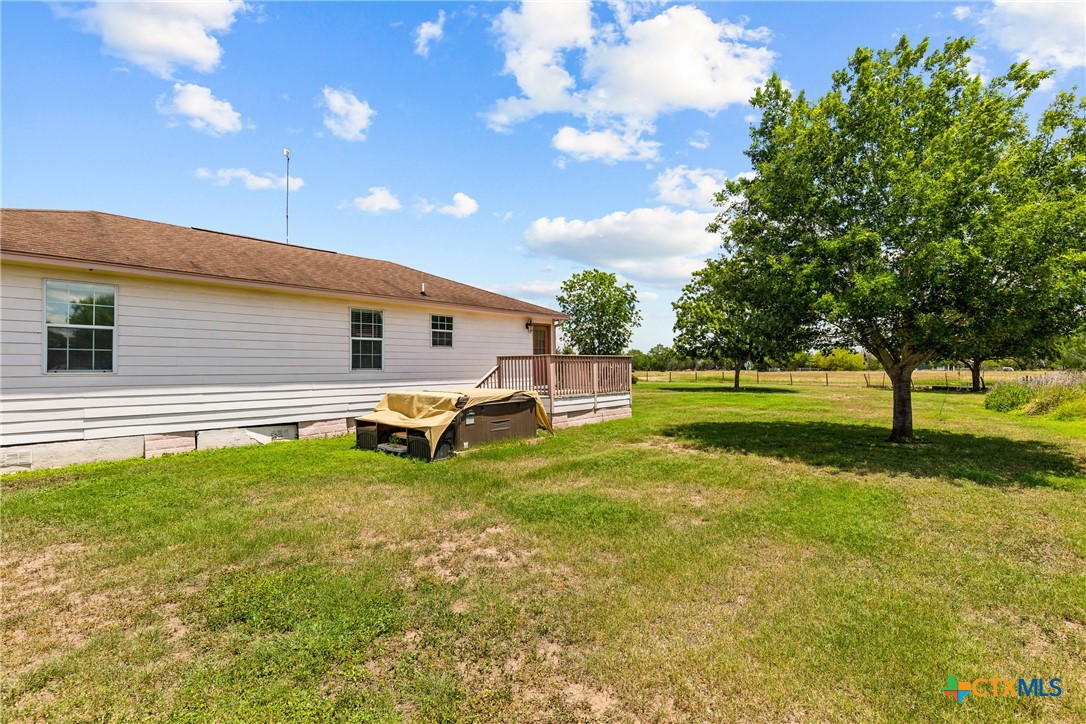 425 Old Pleasanton Road Poteet, TX 78065 - Photo 21 of 38 a view of a house with a big yard