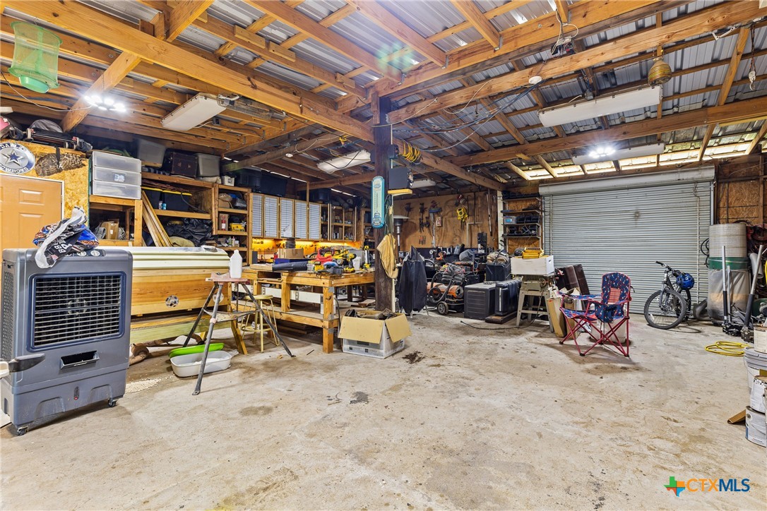 425 Old Pleasanton Road Poteet, TX 78065 - Photo 23 of 38 a view of a storage room with a lot of stuff