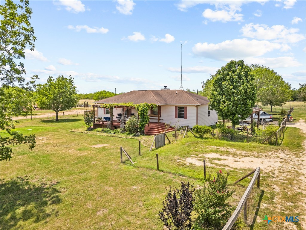 425 Old Pleasanton Road Poteet, TX 78065 - Photo 4 of 38 a view of a swimming pool with a house