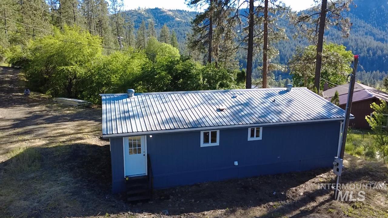 151 View Road Kamiah, ID 83536 - Photo 40 of 49 Detached structure with a blue exterior and white trim, featuring a metal roof
