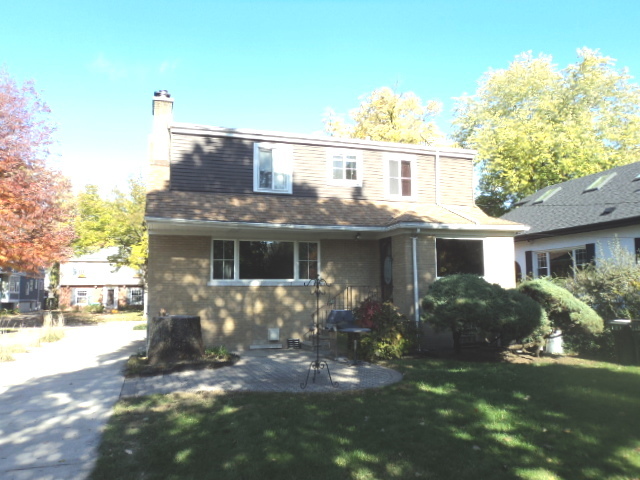 161 Gage Road Riverside, IL 60546 - Photo 4 of 32 a front view of a house with garden