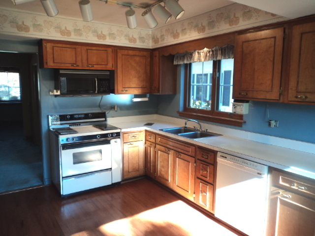 161 Gage Road Riverside, IL 60546 - Photo 7 of 32 a kitchen with stainless steel appliances a stove sink and microwave
