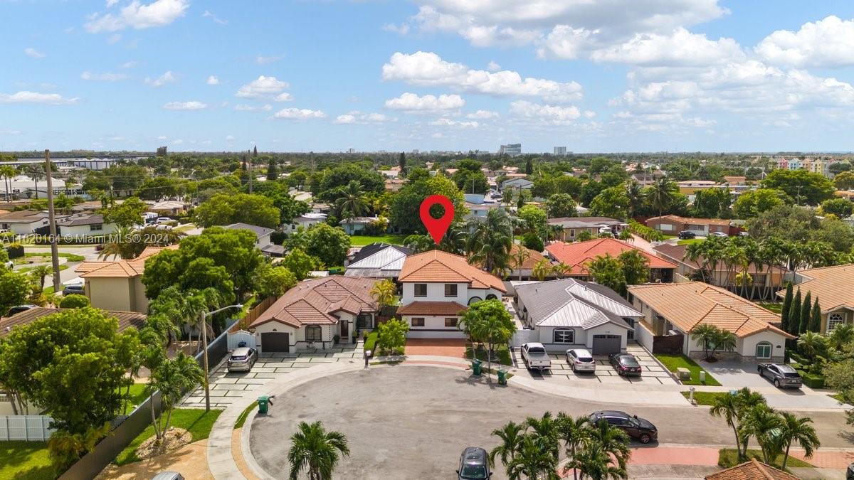 1140 Southwest 85th Court Miami, FL 33144 - Photo 2 of 13 an aerial view of a house with a garden