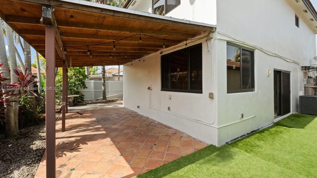 1140 Southwest 85th Court Miami, FL 33144 - Photo 7 of 13 a view of a house with a large window