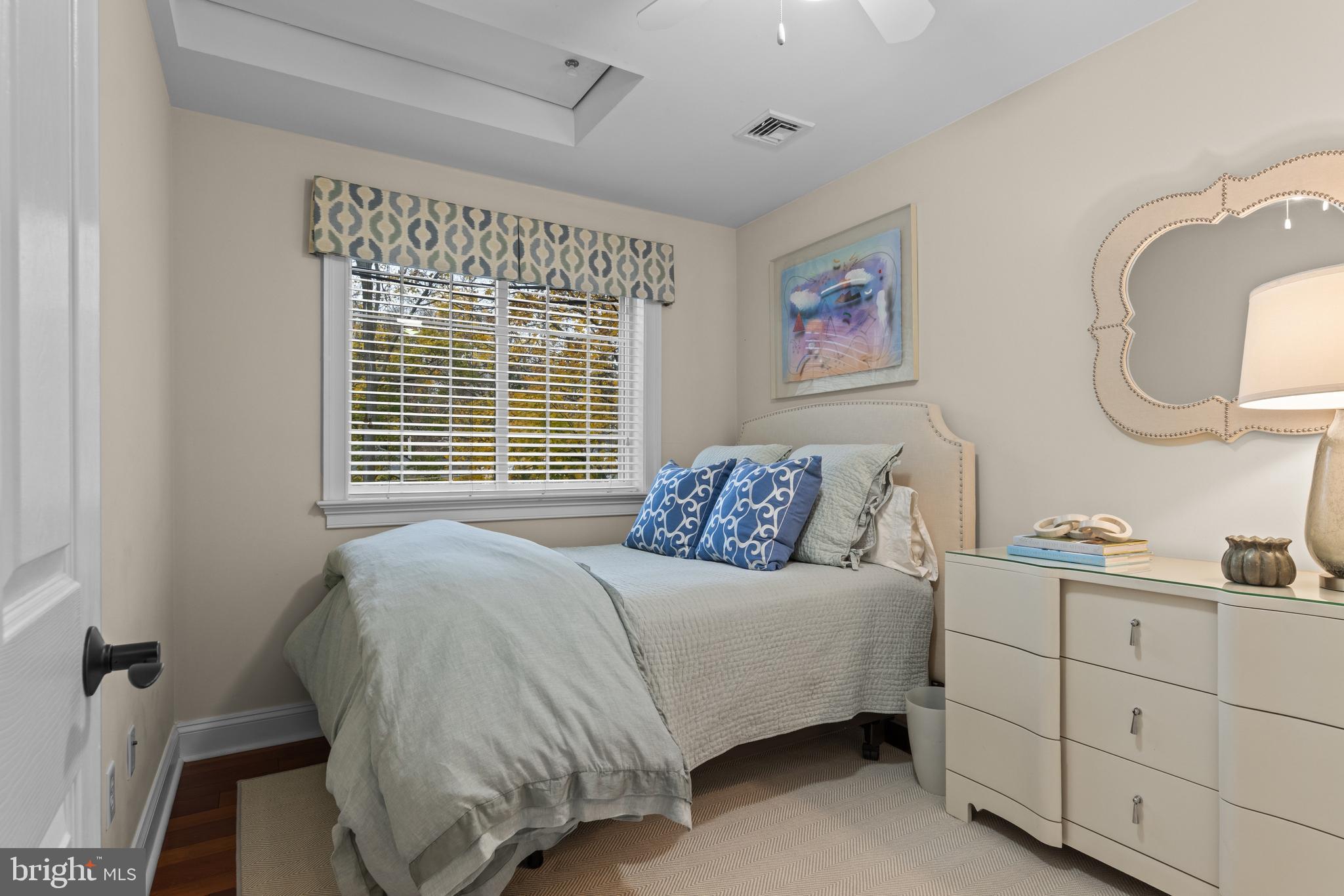 330 Dudley Avenue Narberth, PA 19072 - Photo 16 of 21 a bedroom with a bed and a mirror