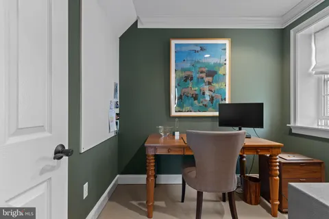 a workspace with furniture and window