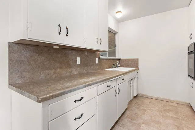 a kitchen with a stove and a microwave