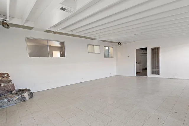 a view of livingroom and workspace