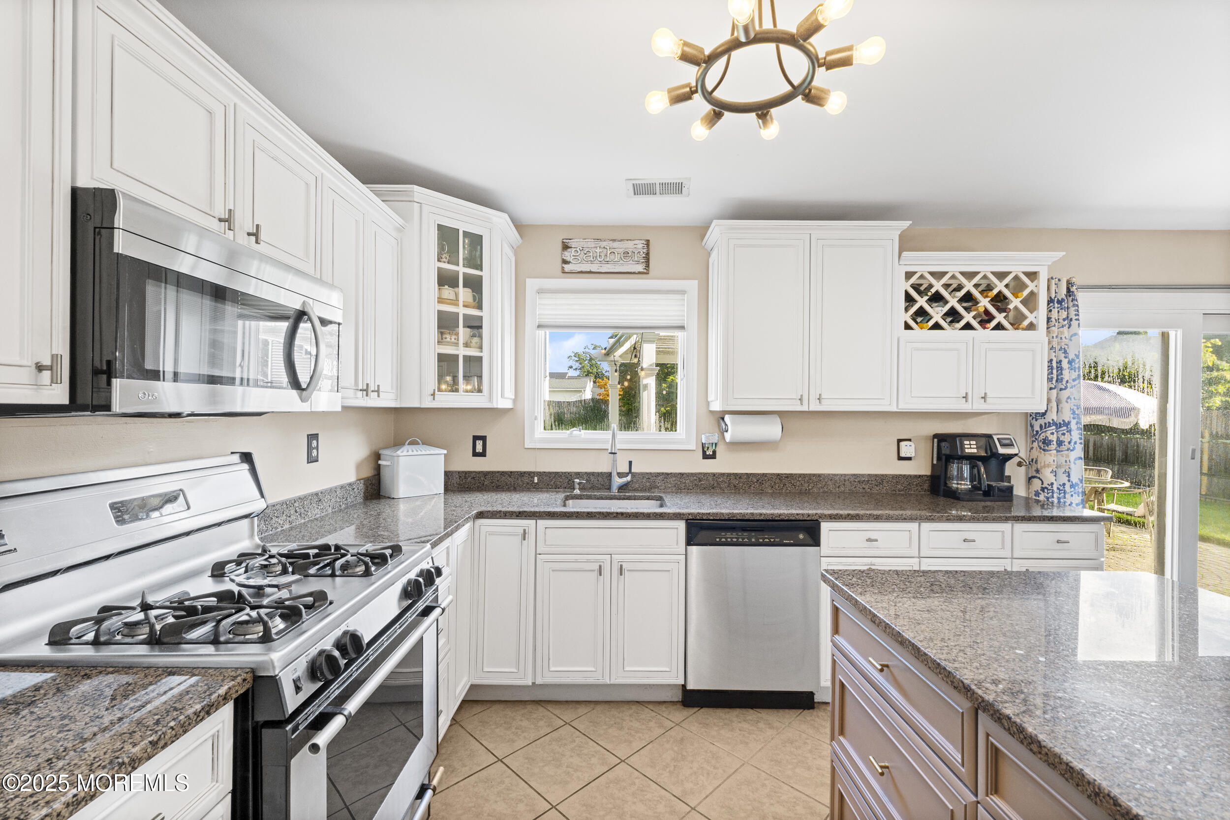 47 Yellowstone Lane Howell, NJ 07731 - Photo 15 of 47 a kitchen with stainless steel appliances granite countertop a sink stove oven and white cabinets