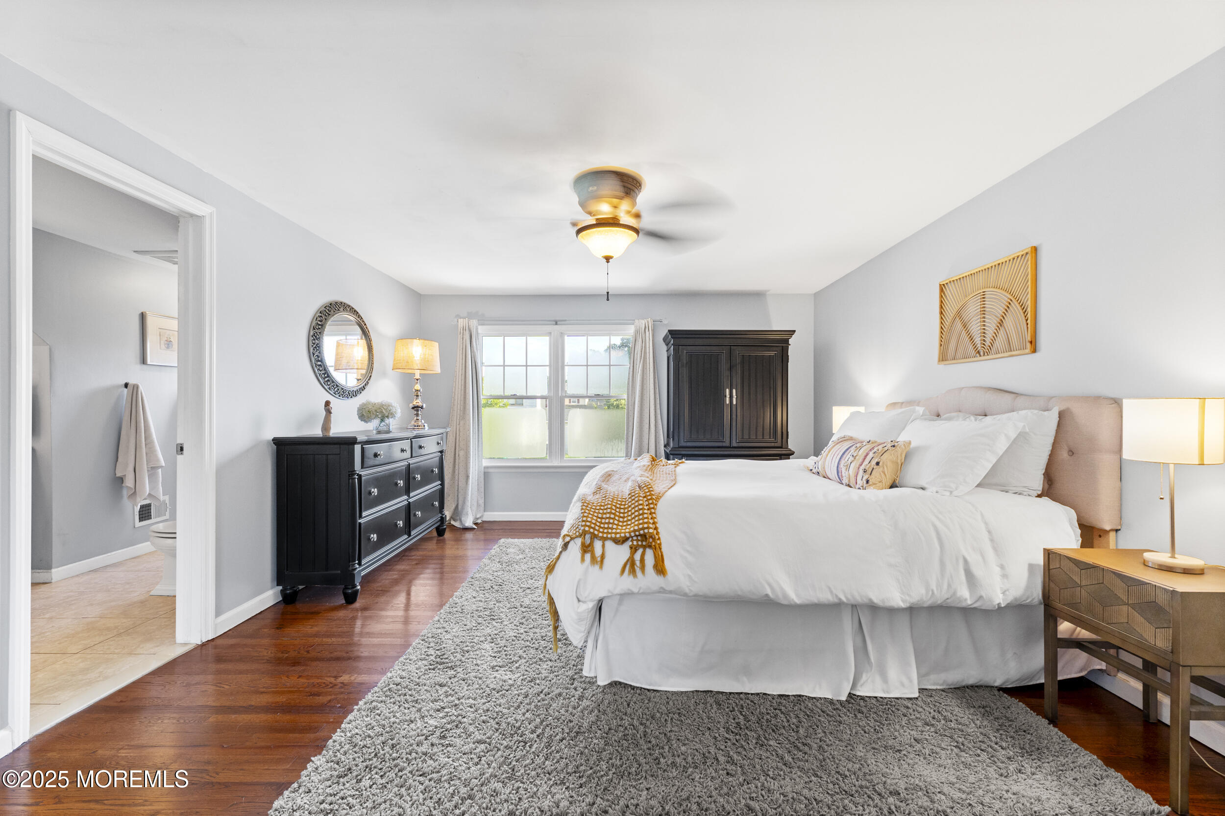 47 Yellowstone Lane Howell, NJ 07731 - Photo 23 of 47 a bedroom with a bed and wooden floor
