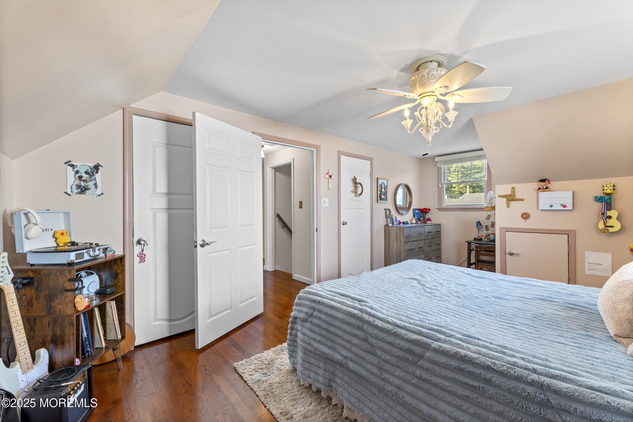 47 Yellowstone Lane Howell, NJ 07731 - Photo 27 of 47 a bedroom with a bed and a chandelier