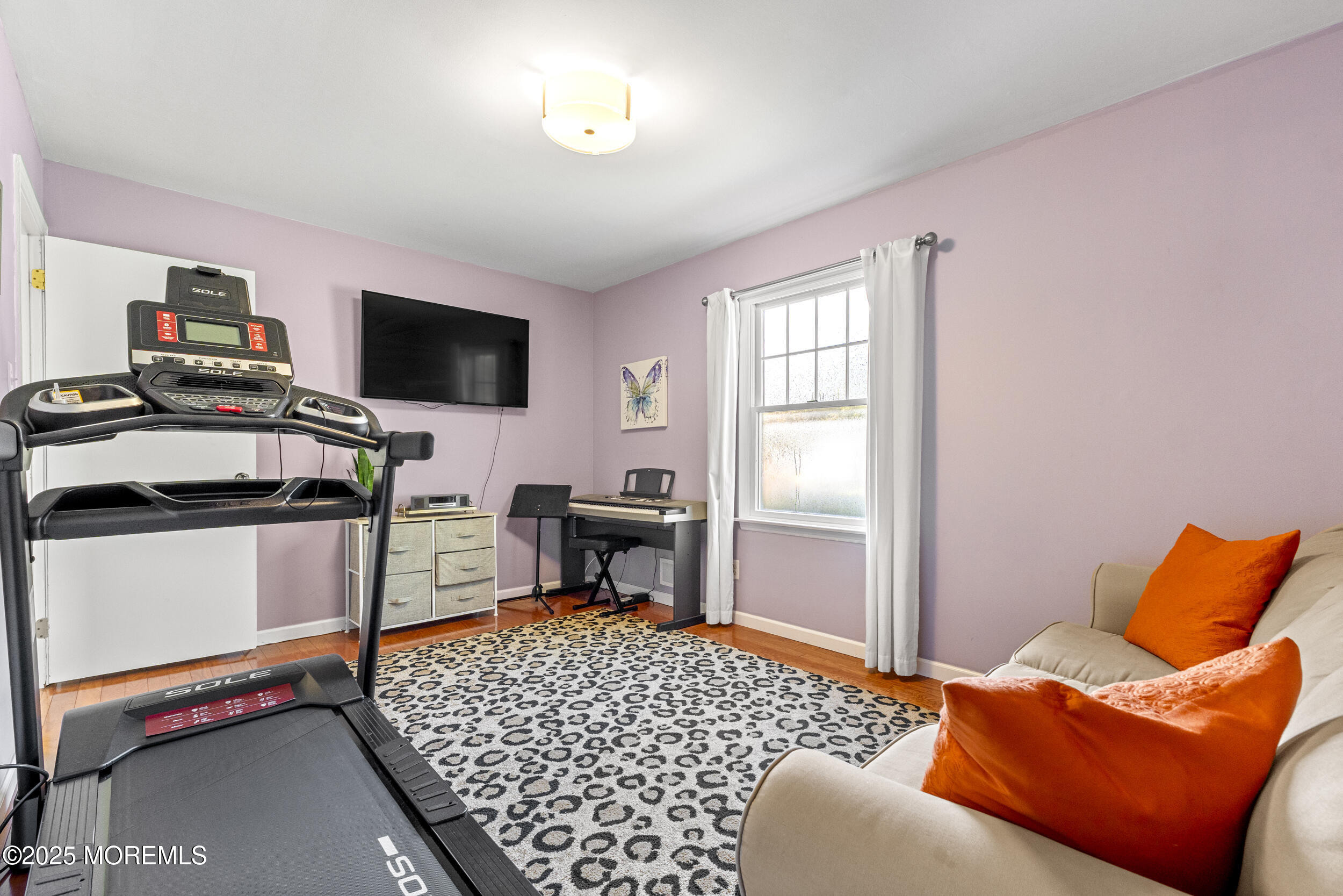 47 Yellowstone Lane Howell, NJ 07731 - Photo 29 of 47 a bedroom with a bed and a television