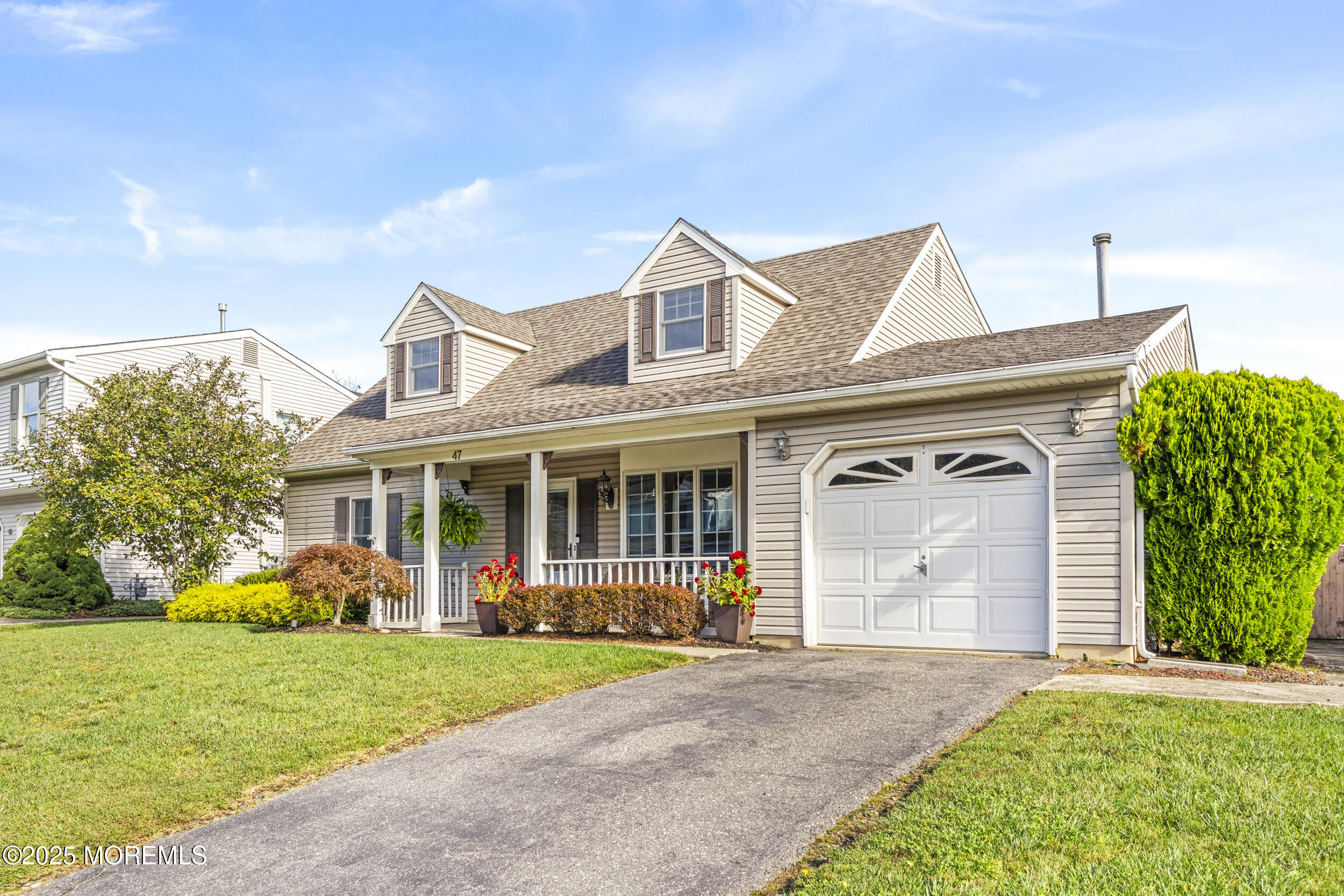 47 Yellowstone Lane Howell, NJ 07731 - Photo 3 of 47 a front view of a house with garden