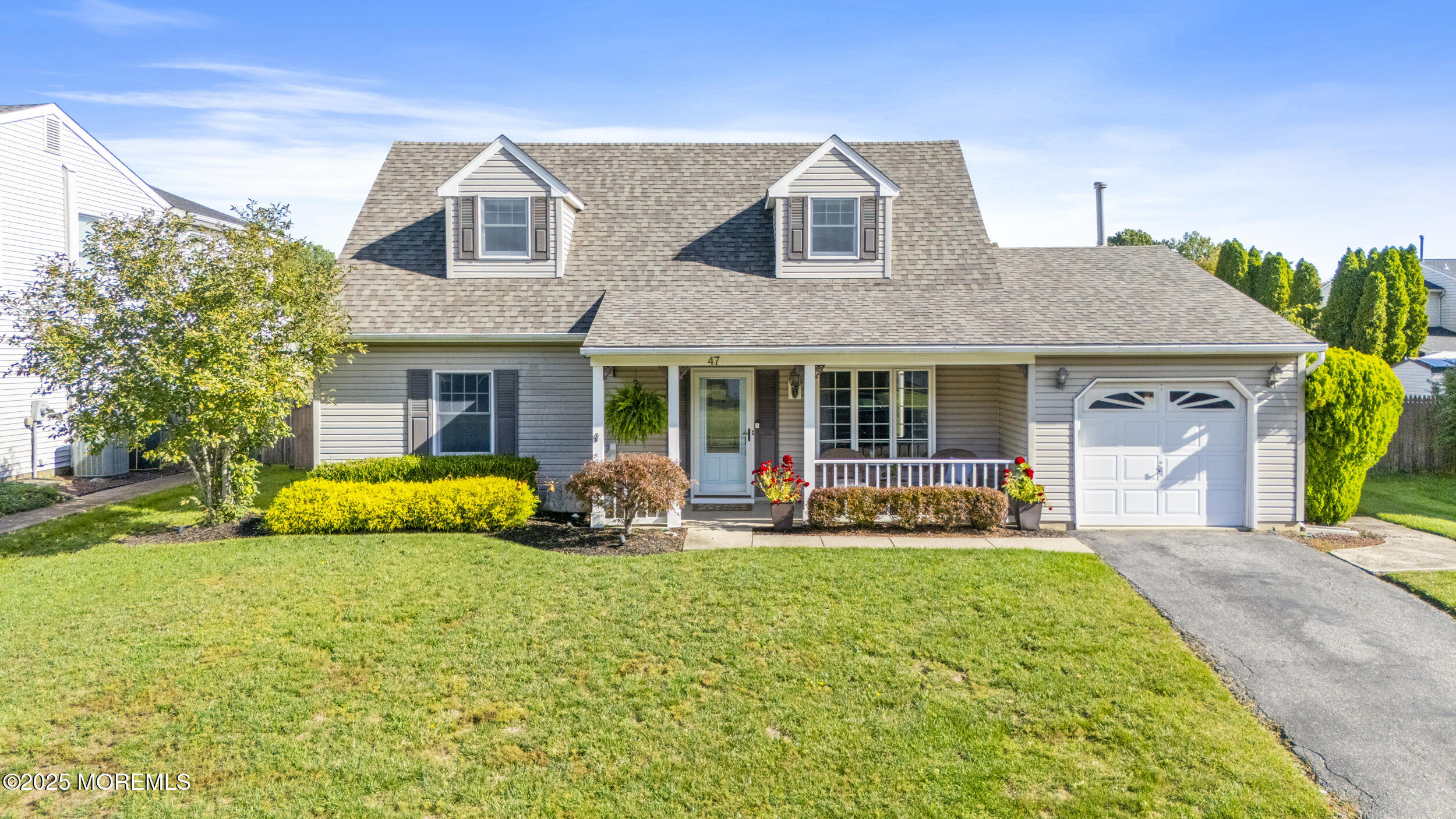 47 Yellowstone Lane Howell, NJ 07731 - Photo 44 of 47 a front view of a house with garden and porch