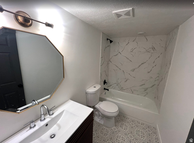 545 23rd Street Ogden, UT 84401 - Photo 19 of 28 Bathroom featuring a modern vanity with integrated sink, chrome fixtures, and an octagonal mirror