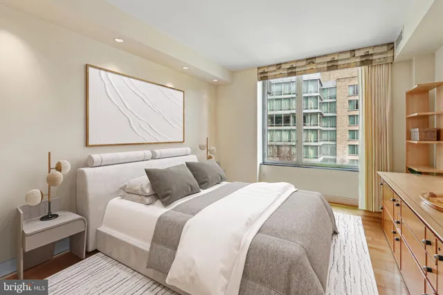 a bathroom with a granite countertop sink a mirror and a shower
