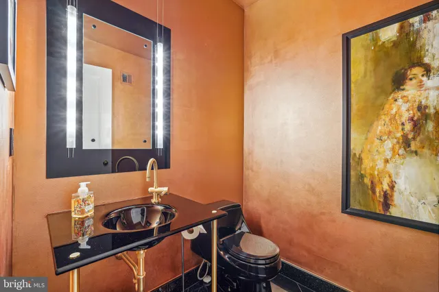 a view of a livingroom with workspace and a window