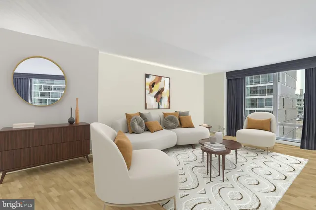 a living room with furniture a rug and a window