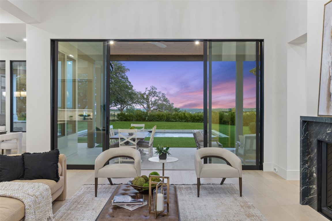 5813 Horizon Vista Way Austin, TX 78738 - Photo 11 of 38 a living room with furniture and a floor to ceiling window