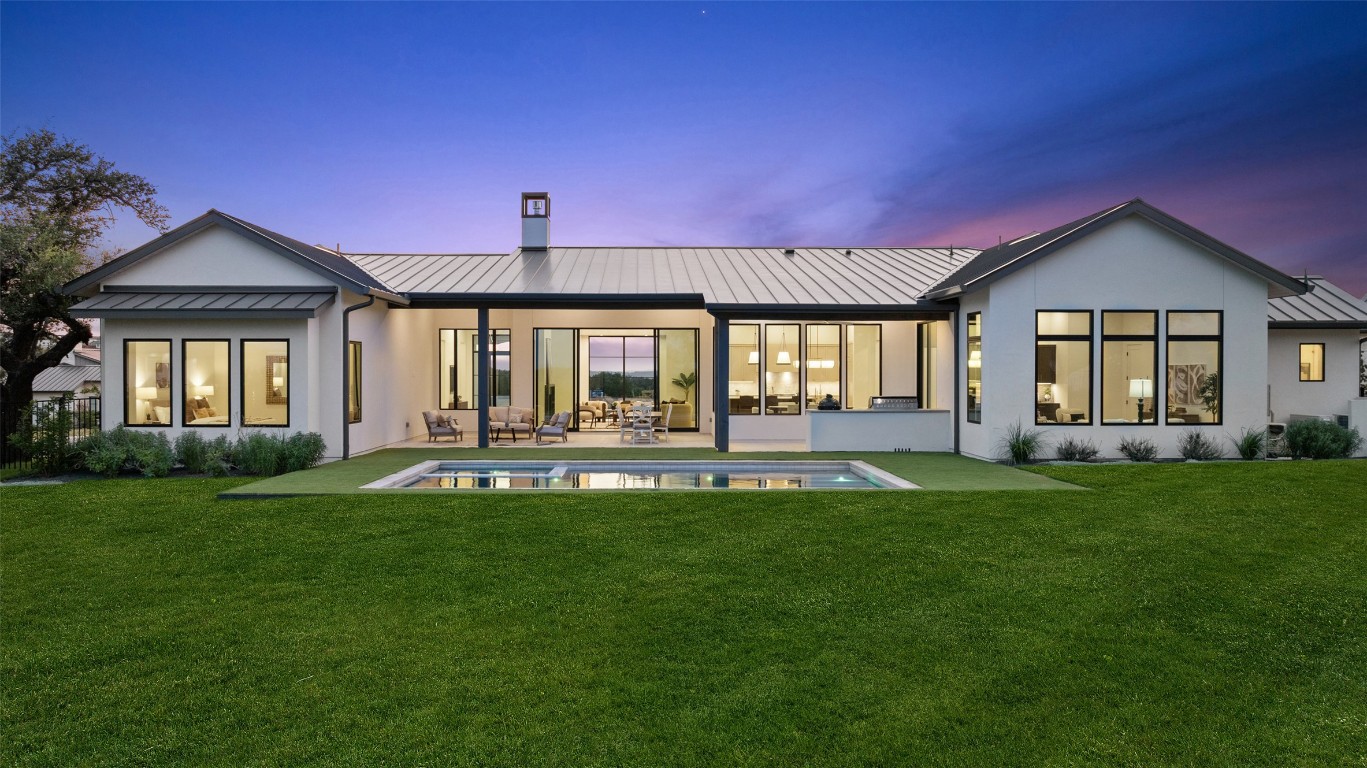5813 Horizon Vista Way Austin, TX 78738 - Photo 34 of 38 a backyard of a house with table and chairs