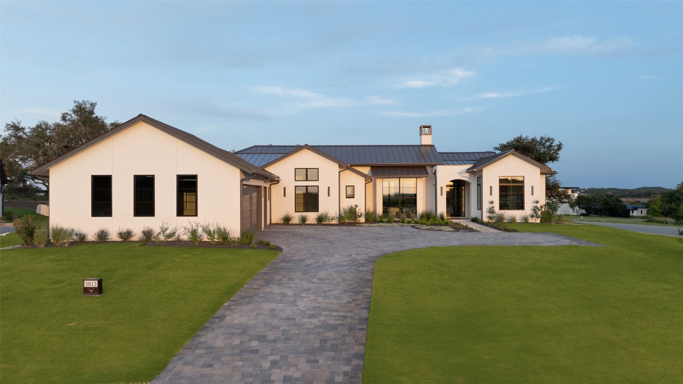 5813 Horizon Vista Way Austin, TX 78738 - Photo 37 of 38 a front view of a house with a yard