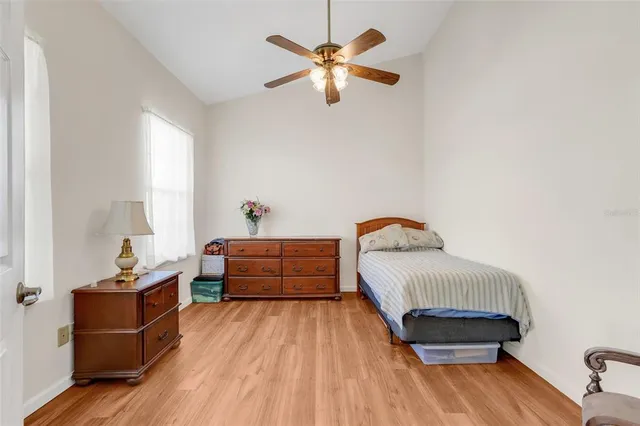 a bedroom with bed and window